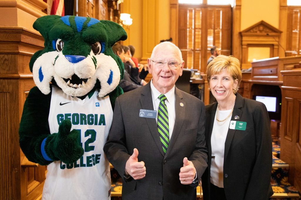 State Senator Rick Williams, center, poses with President Cathy Cox and Thunder in the Georgia State Senate